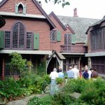 People stand outside the Sleeper McCann mansion