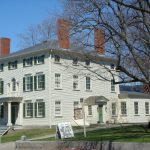 A white mansion, the Heard House, in spring