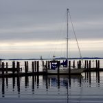 Sailboat in the harbor at Lyn Heritage State Park on a cloudy day
