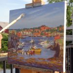 An artist of the Rocky Neck Art Colony painting the harbor